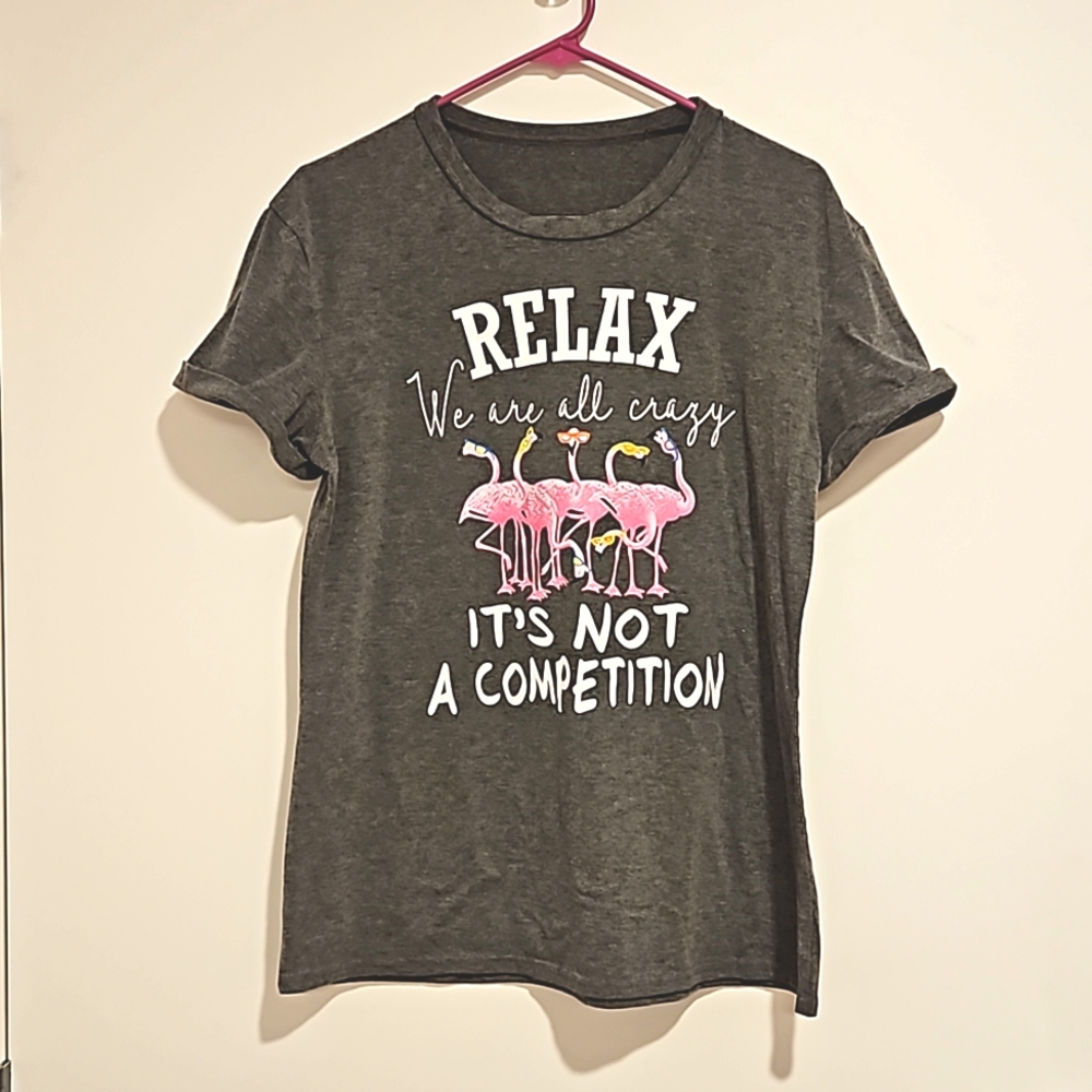 'Relax we are all crazy. It's not a competition' flamingo gray graphic tee Med.